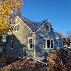 Hidden fastener Steel Roof and Seamless Gutters, Window Wraps and chimney removal